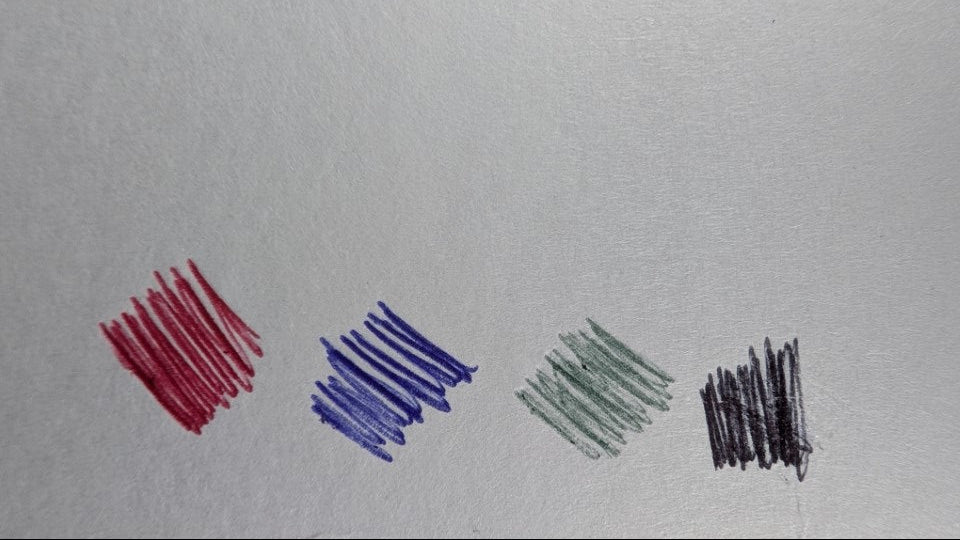 Four colored scribbles on a gray background